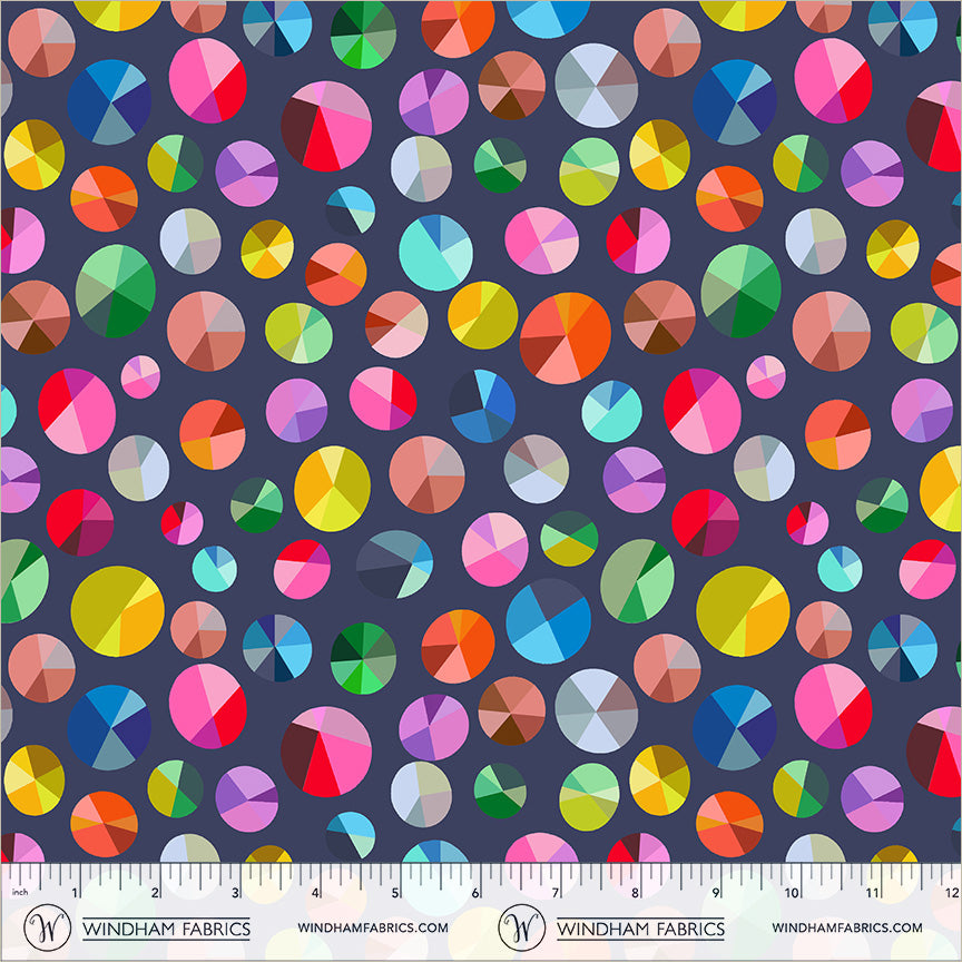 A repeating pattern of colorful pie charts in various sizes on a dark slate gray background. Happy Place | Annabel Wrigley | Freewheel - Night Sky