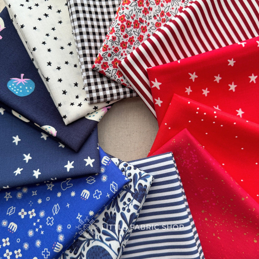 Collection of patterned fabric swatches in red, blue, and white on a neutral background. Star-Spangled 250 Stack | Fat Quarter Bundle | Little Fabric Shop 4th of July Custom Fabric Bundle