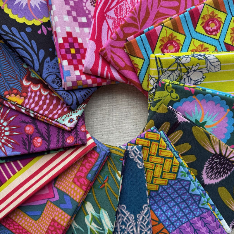 Collection of colorful fabric swatches arranged in a circular pattern. Anna Maria Fabric | Fat Quarter Bundle 1 