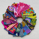 Collection of colorful fabric swatches arranged in a circular pattern. Anna Maria Fabric | Fat Quarter Bundle 1 