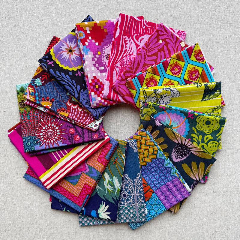 Collection of colorful fabric swatches arranged in a circular pattern. Anna Maria Fabric | Fat Quarter Bundle 1 