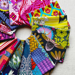 Collection of colorful fabric swatches arranged in a circular pattern. Anna Maria Fabric | Fat Quarter Bundle 1 