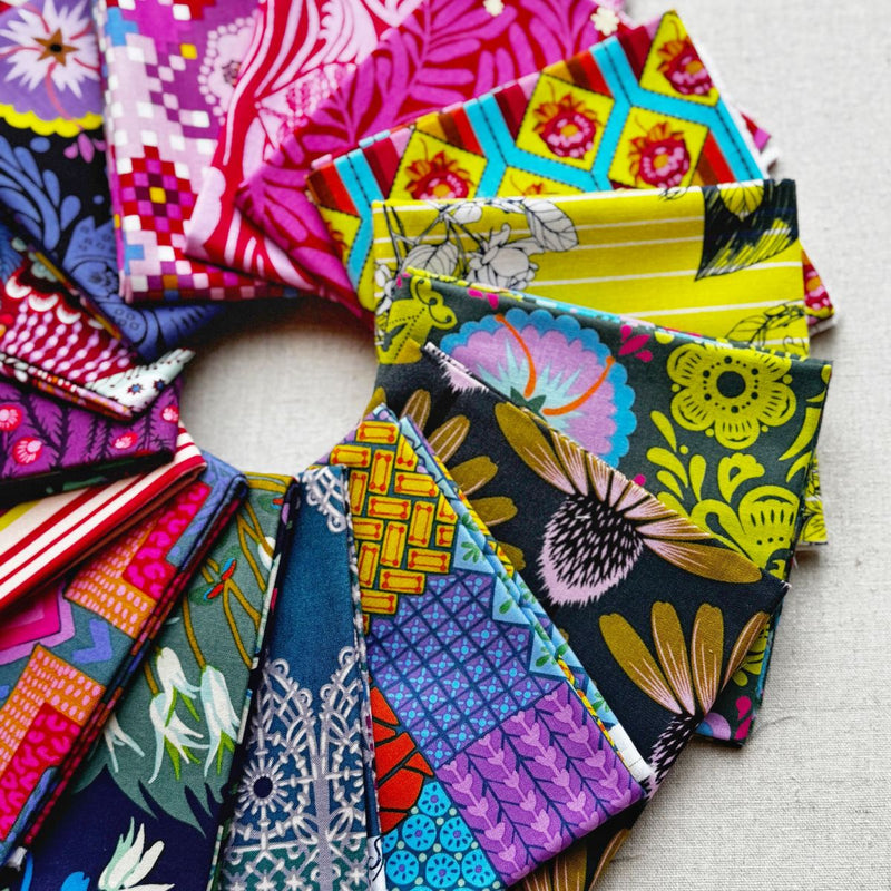 Collection of colorful fabric swatches arranged in a circular pattern. Anna Maria Fabric | Fat Quarter Bundle 1 