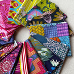 Collection of colorful fabric swatches arranged in a circular pattern. Anna Maria Fabric | Fat Quarter Bundle 1 