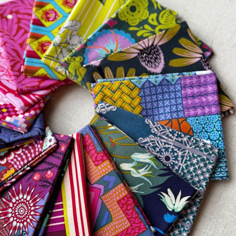 Collection of colorful fabric swatches arranged in a circular pattern. Anna Maria Fabric | Fat Quarter Bundle 1 
