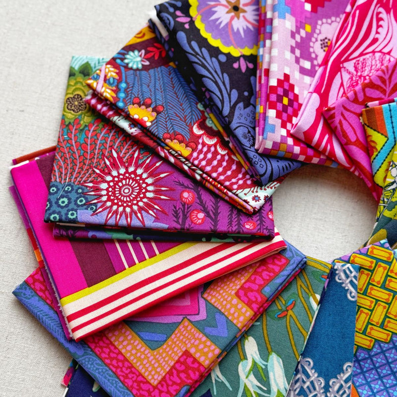 Collection of colorful fabric swatches arranged in a circular pattern. Anna Maria Fabric | Fat Quarter Bundle 1 