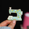 Interactive Floral Sewing Machine in Turquoise Enamel Pin | The Gray Muse