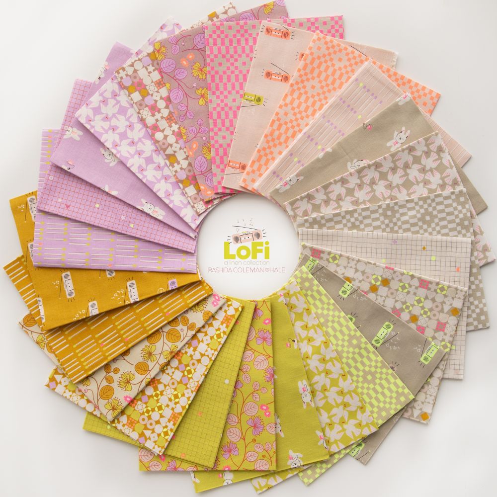 Fabric package with dog pattern and black ribbon on a white background. LoFi Linens | Ruby Star Society | Half Yard Bundle