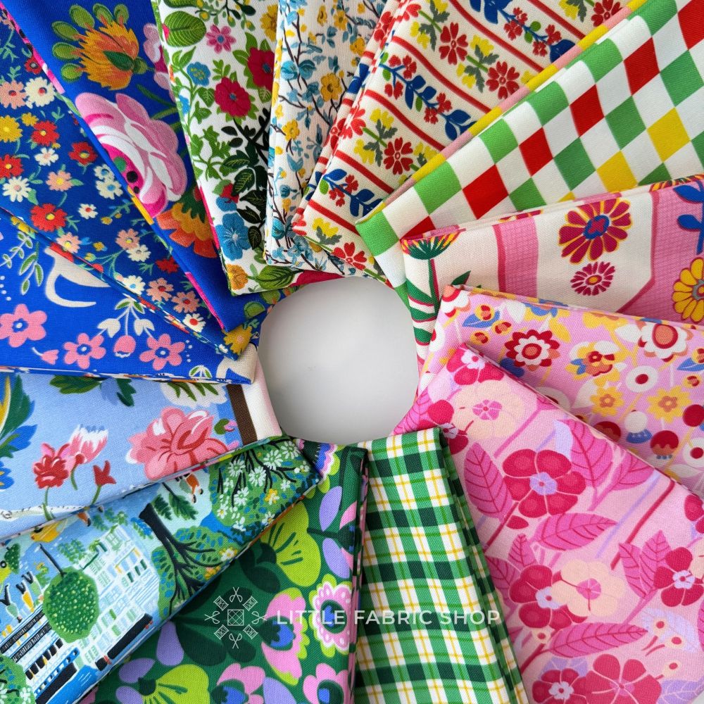 A circular arrangement of multiple colorful fabric pieces with different patterns, including florals, stripes, and plaid, displayed on a plain white background. A watermark reading 'LITTLE FABRIC SHOP' is visible near the bottom. Stannie & Lloyd | August Ellery | Half Yard Bundle